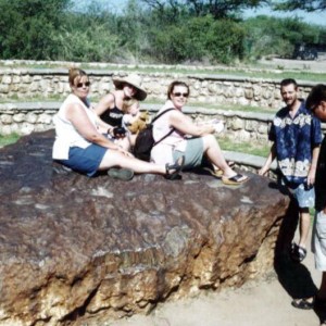 All seated on the Hoba Meteorite which is the largest meteor fragment on earth.