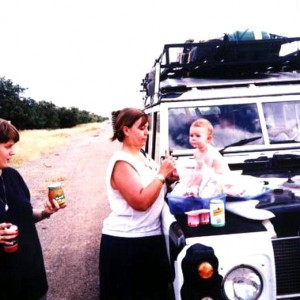 Emma eating yoghurt lunch on Lily's bonnet while we waited for the african bureacracy to happen.
